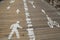 Bicycle and pedestrian path on the wooden pedestrian walkway at the center of the Brooklyn Bridge