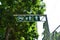 Bicycle and pedestrian shared route sign on green metal signpost