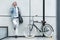Bicycle, phone call and business man in city for communication, networking and carbon footprint travel marketing update