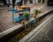 Bicycle with potted flowers in the waters of Freiburg Bachle in Germany