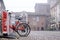 Bicycle rental bike rack in the town square in Pavia. Bicycle rental point. Public transport: Pavia, Italy - January 28, 2020