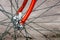 Bicycle repair. Wheel and shiny axle of chrome steel of an old road bike closeup. Retro bike. Red iron fork. Quick Release