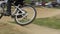 Bicycle rider BMX races difficult track, spinning wheels daytime
