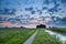 Bicycle road and canal at sunrise