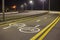 Bicycle Road Markings and Signs. Illuminated bicycle lane travel lane reserved for bicyclists with pavement markings with arrows