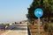 Bicycle road sign at the beachside with two cyclist