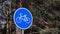 Bicycle route sign on a city street. Blue road sign bicycles only outdoor activities on a sunny day. Healthy lifestyle