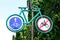 Bicycle route sign on green metal signpost