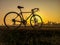 bicycle on rural straw landscape image with Silhouette morning