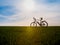 Bicycle silhouettes on the dark background of sunsets