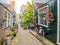 Bicycle in small street Kerkepad in Volendam, Noord-Holland, Netherlands