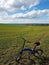 Bicycle stands in a green field