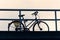 Bicycle on a street silhouette against dusk sky