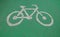 Bicycle symbol on green asphalt road, Surface rough of bike lane, Texture Background.