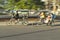 Bicycle taxis speeding through the streets with sunlight on it in Havana, Cuba