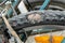 A bicycle tire is damaged. An old bicycle. Selective focus. Old worn out bicycle tire.