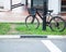 Bicycle top tube is securely chained, by chain link and lock, to the metal lamp post in the garden. Outdoor Activity, Exercise,