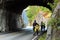 Bicycle tourists with heavy loaded touring bags on bikes