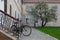 Bicycle and tree in completely stone built-up area