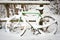 Bicycle under pack of snow