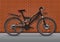 Bicycle vector realistic illustration. Black metallic bike half-face with many multiple details standing on asphalt against a bric