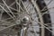 Bicycle wheel on the background of wheel spokes