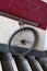 Bicycle wheel locked to a wall handrail. Forgotten bike stolen