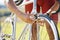 Bicycle, wheel and a man outdoor fixing puncture or problem while cycling. Bike, hands and a sports person, cyclist or