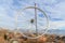 Bicycle wheel rim against homes mountain and sky