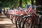 Bicycles with American flags in the park on a sunny day, Decorated bicycles lined up for a Fourth of July parade, Independence Day