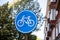Bicycles lane sign, White bike icon on round blue color sign. Dutch road sign