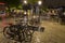 Bicycles parked at night in historical part of Rotterdam