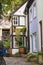 Bicycles and trees in cozy backyard. Summer patio with bikes. Bicycles in front of old house. Traditional exterior in Europe.