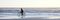 Bicyclist on Beach at Sundown