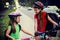 Bicyclist child ride on city bicycle path . Girls wearing helmet .