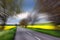 Bicyclist in red driving on rural road