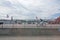 Bicyclist and tourists near ferry tour boats