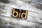 Bid Letterpress Word on Wooden Background