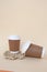 Bidegradable paper brown coffee cups with biodegradable white lids.