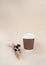 Bidegradable paper brown coffee cups with biodegradable white lids.