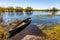 Biebrza river valley wetlands and nature reserve landscape with vintage canoe in Wierciszewo village in Poland