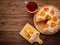 Big Apple pie with apricot, cup of tea, charlotte on dark brown wooden table, top view, copy space