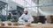 Big bakery industry funny baker with beard preparing the dough for baking bread and dancing at the same time while