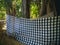 Big Banyan Tree Trunk Growing Around The Temple Area With Typical Balinese Sacred Cloth