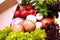 Big Basket with vegetables mushrooms, basil, lettuce, onions, garlic, radishes and tomatoes.