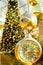 Big beautiful Christmas tree decorated with ornaments golden silver hanging balls bows garland sparkling lights in european city