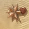 Big beige 3d star with reflection effect and brown heart on the patterned background. 3d illustration, 3d rendering