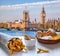 Big Ben against fish and chips served on the table in London, United Kingdom