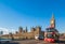 Big Ben and Blue Sky and moving london red bus