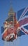 Big Ben, Clock Tower, Parliament House and British Flag merged in a double exposure shot of flag and historic London Building